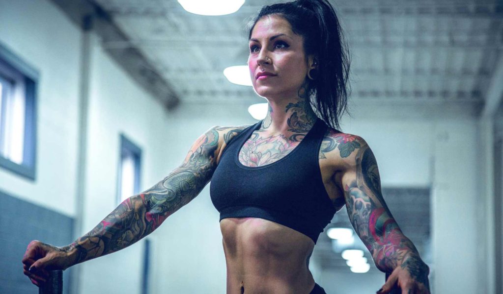 Woman with tattoos after workout