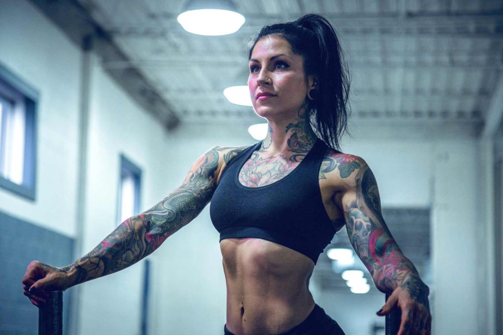 Woman with tattoos after workout
