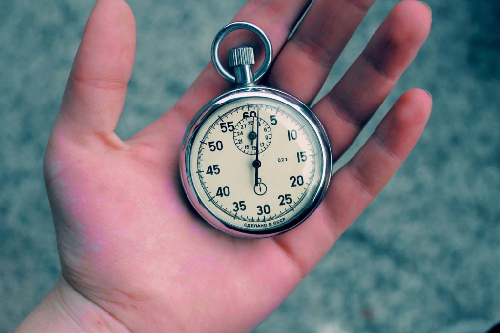 hand holding stopwatch