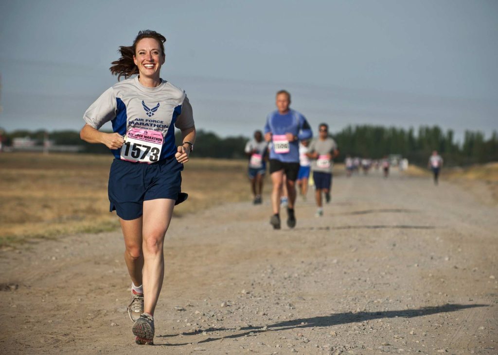 woman running in marathon race