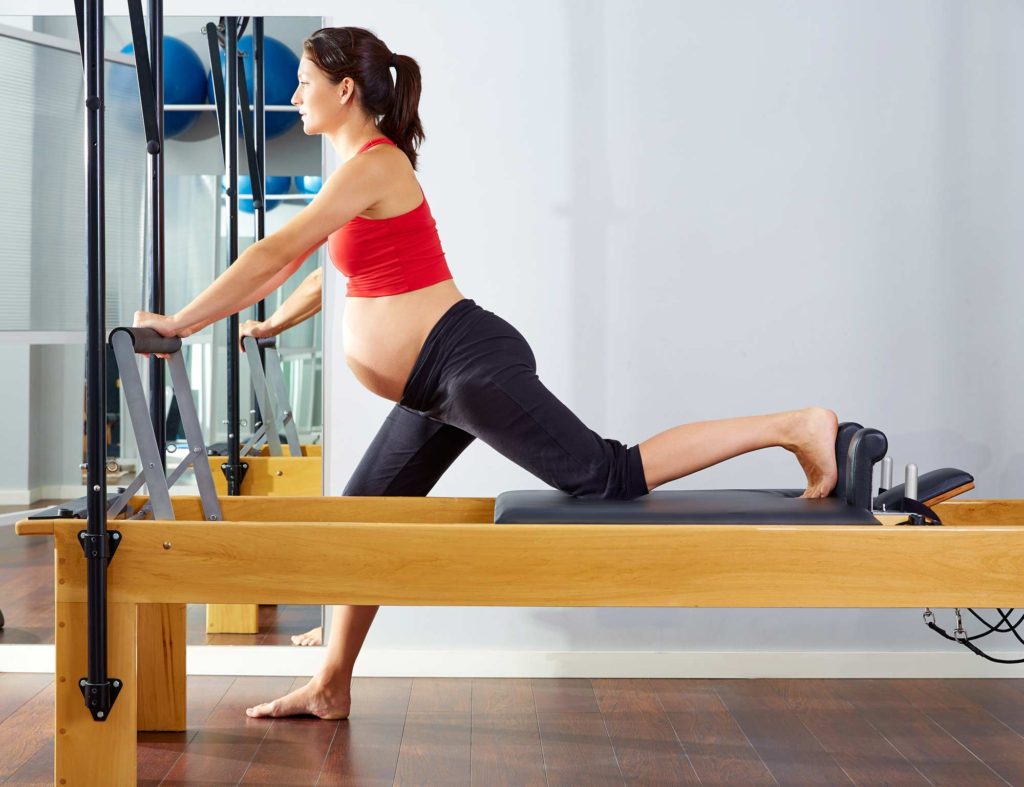 pregnant woman doing pilates