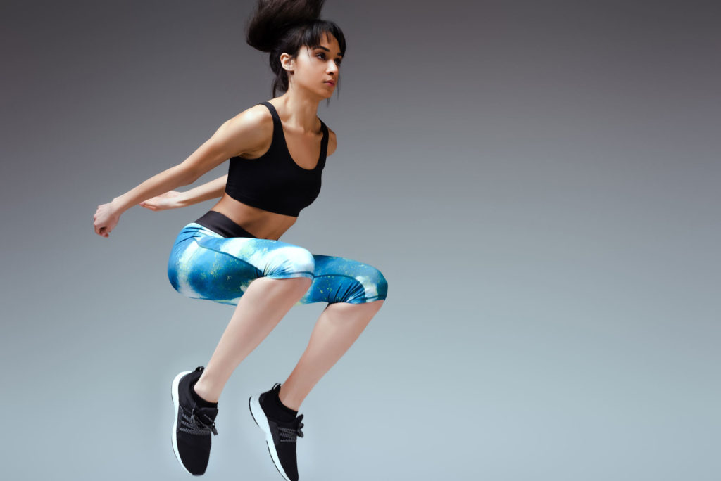 woman doing jump tuck plyometric cardio circuit